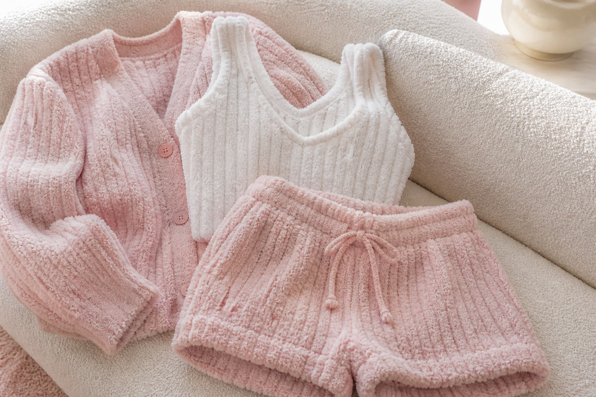 Vela Signature velvet ribbed lounge set in blush pink, folded flat-lay showing the soft ribbed knit